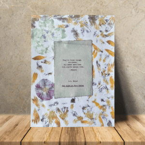 Art made using pigment from real plants as a backdrop. Atop, on handmade cotton paper, is a hand typed quote from A. A. Milne's book The House at Pooh Corner.