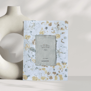 Art made using pigment from real plants as a backdrop. Atop, on handmade cotton paper, is a hand typed quote from A. A. Milne's book Winnie-the-Pooh.