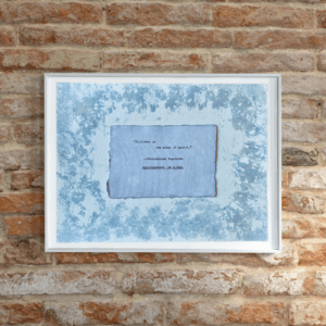 Art made using pigment from real plants depicting a blue backdrop with a typewritten quote by Paramahansa Yogananda on handmade cotton paper on top.