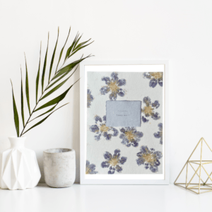 Art made using pigment from real dahlia plants as a backdrop. Atop, on handmade cotton paper, are the hand typed plant common name and botanical name.