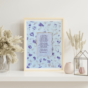 Art made using pigment from real plants depicting a floral backdrop with a typewritten quote from The Bhagavad-Gita on handmade cotton paper on top.