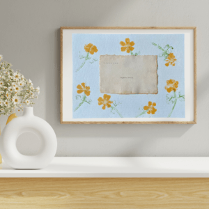 Art made using pigment from real marigold plants as a backdrop. Atop, on handmade cotton paper, are the hand typed plant common name and botanical name.