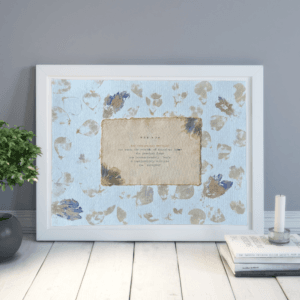 Art made using pigment from real plants as a backdrop. Atop, on handmade cotton paper, is a hand typed description for the archetype, the mum.