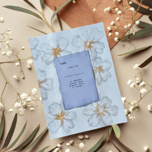 Art made using pigment from real plants as a backdrop. Atop, on handmade cotton paper, is the hand typed action verb, prosper, followed by its definition.