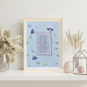 Art made using pigment from real plants depicting a floral backdrop with a typewritten quote from The Bhagavad-Gita on handmade cotton paper on top.