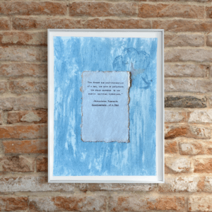 Art made using pigment from real plants depicting a blue backdrop with a typewritten quote by Paramahansa Yogananda on handmade cotton paper on top.