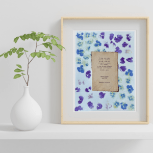 A Moment quote from Poster Girls by Meredith Ritchie on handmade floral paper with violets and roses
