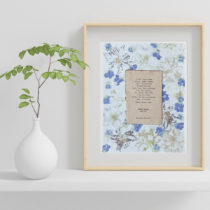 Courage quote from Poster Girls by Meredith Ritchie on handmade floral paper with violets and lenten roses