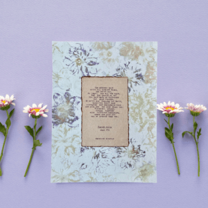 Our Differences Make the Difference quote from Poster Girls by Meredith Ritchie on handmade floral paper with lenten roses