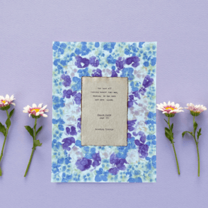 Running Man quote from Poster Girls by Meredith Ritchie on handmade floral paper with violets and roses