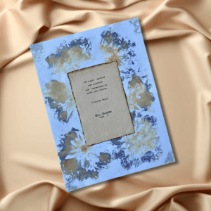 Handmade art with dahlia floral paper background using real flowers. Handmade cotton paper foreground with double sided, typewritten Virginia Woolf quotes.
