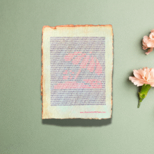Handmade typewriter art on handmade, recycled, deckled-edged cotton paper. The repeated words, “beach bum” are hand typed in black on a typewriter. The red letters form a visual of a beach scene and umbrella. The piece is displayed on a sage green background with light pink carnations arranged to the right. At the bottom of the art, the website “www.PlantsAreMyType.com” appears in red.